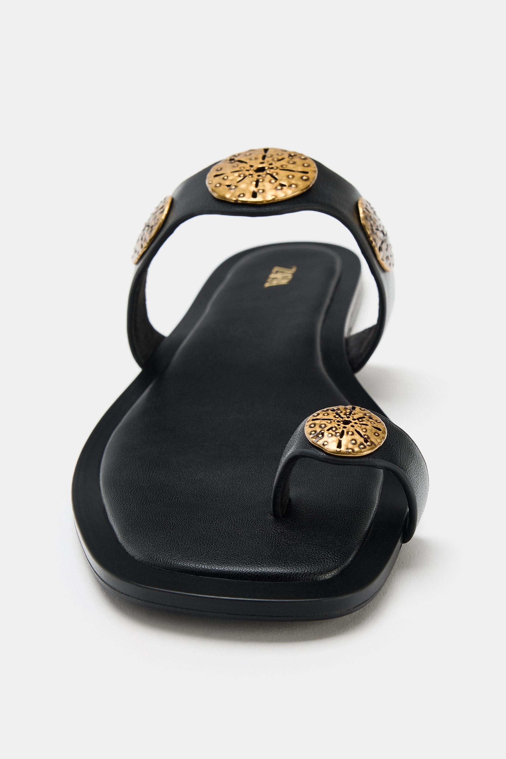 FLAT SANDALS WITH METALLIC DETAILS